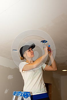 Kitchen Remodel Young Woman Working with Electrical Wires