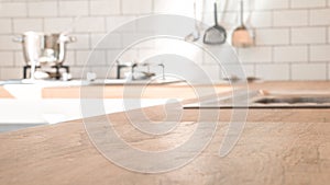 Kitchen room and background concept - blurred brown wooden top of kitchen counter with beautiful modern vintage kitchen room