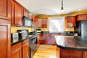 Kitchen room with black granite tops