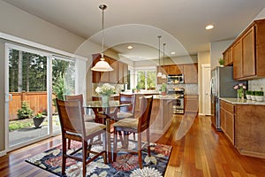 Kitchen room interior with hardwood floor and granite counter top