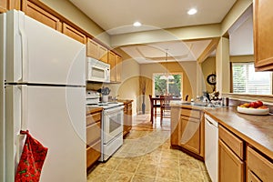 Kitchen room interior with tile floor connected to dining area