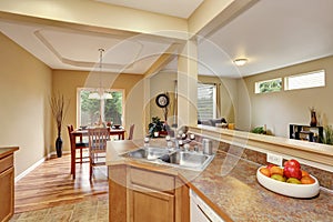 Kitchen room interior with tile floor connected to dining area