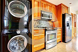 Kitchen room with laundry appliances