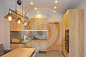 Kitchen room with lighting. Modern minimalism with loft elements
