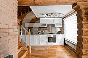 The kitchen room in a rustic log cabin, in the mountains. with a beautiful interior. house of pine logs