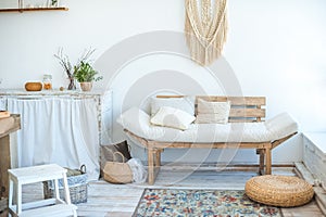 Kitchen in rustic style in summer. Spring light textured kitchen with an old fridge, wooden table. Beautiful eco-friendly wooden s