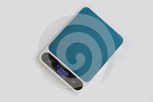 Kitchen scales on a colored background preparation