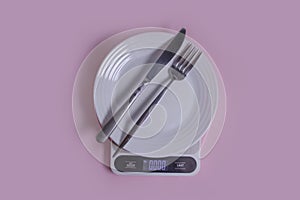 Kitchen scales, empty plate cooking   a colored background