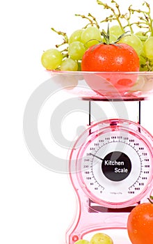 Kitchen Scales with fresh tomatoes and grapes