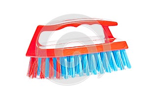 Kitchen scrubbrush with red handle isolated