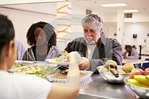 Kitchen Serving Food In Homeless Shelter