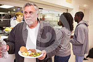 Kitchen Serving Food In Homeless Shelter