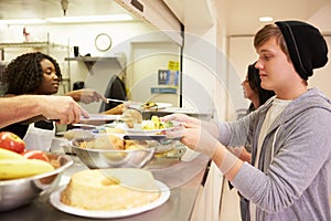 Kitchen Serving Food In Homeless Shelter