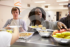 Kitchen Serving Food In Homeless Shelter