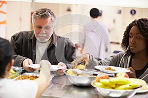 Kitchen Serving Food In Homeless Shelter