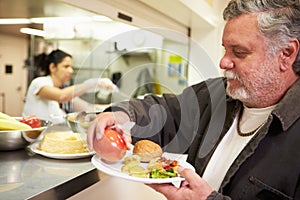 Kitchen Serving Food In Homeless Shelter photo