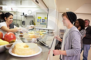 Kitchen Serving Food In Homeless Shelter photo