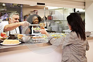 Kitchen Serving Food In Homeless Shelter