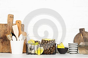 Kitchen shelf lifestyle white background with fresh lemons, pineapple, kitchen tools, appliances, chopping boards