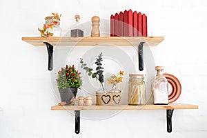 Kitchen shelfs with spices, autumn white interior
