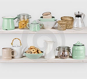 Kitchen shelves interior with utensils and food ingredients on white