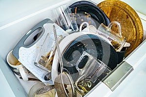 Kitchen sink with dirty dishes and utensils. Mess and sink. Dirty kitchen utensils