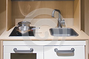 Kitchen sink and electric stove