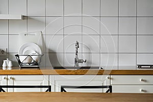 Kitchen sink and faucet. Stainless kitchen sink and tap water. The interior of the modern kitchen room in the loft