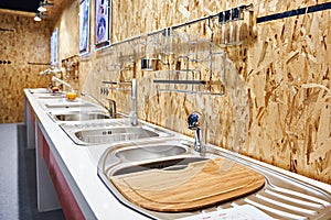 Kitchen sinks and faucets in store
