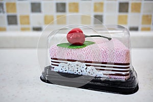 Kitchen sponge in a form of cake decorated with