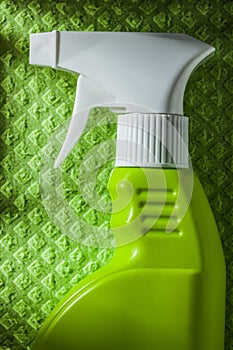Kitchen sprayer on green dishcloth