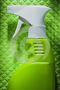 Kitchen sprayer on green dishrag