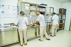 Kitchen staff team in uniform doing their work