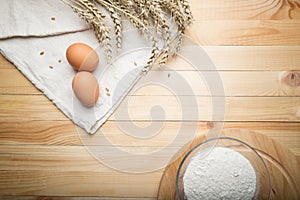 Kitchen still life from flour, wheat ears and eggs