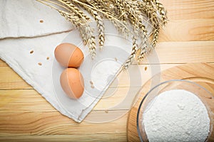 Kitchen still life from flour, wheat ears and eggs