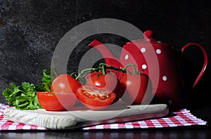 Kitchen still life with tomatos and tea pot