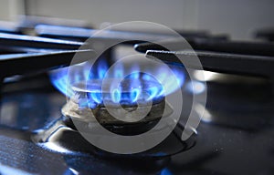 Kitchen stove grate on a burner fuelled by combustible natural gas or syngas, propane, butane. Cooker as heater. Wastage