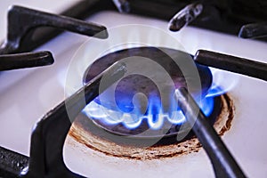 Kitchen stove with natural gas burner and blue flame