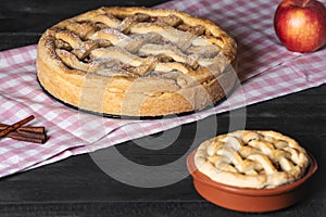 Kitchen table with apple pies. Traditional baked dessert. Sweet