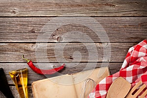 Kitchen table with recipe book and ingredients