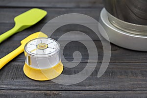 Kitchen timekeeping and cooking tool on wood table