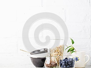 Kitchen tools, olive cutting board on a kitchen shelf against a white brick wall. selective focus