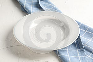 Kitchen towel with plate on white background