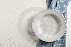 Kitchen towel with plate on white background
