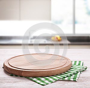 Kitchen towel on wooden table. Napkin close up top view mock up for design. Kitchen rustic background.