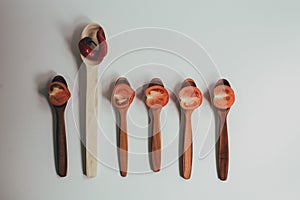 Kitchen utencils set for takeaway business: wooden recycling eco spoon, fork isolated on white side view. Eco style, wood, wooden