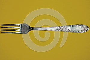 Kitchen utensil from a one of gray old metal fork