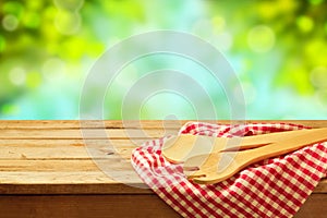 Kitchen utensil over garden background photo