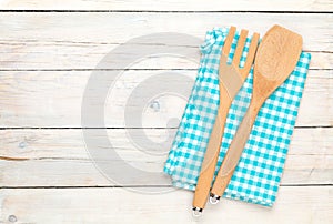 Kitchen utensil over white wooden table background