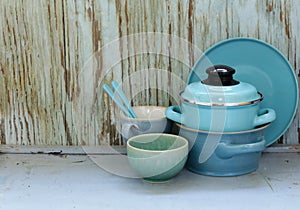 Kitchen utensils, cooking pans on a wooden background